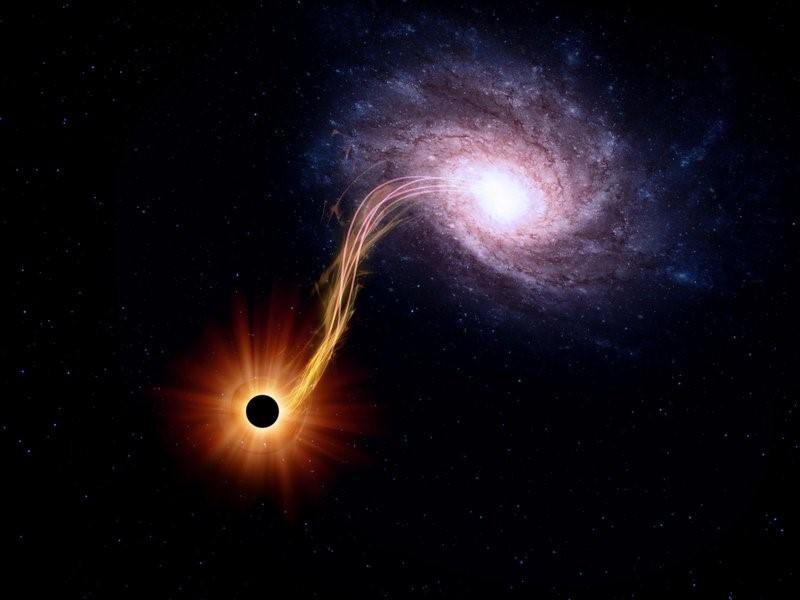 صورة تخيلية لثقب اسود يقوم بابتلاع مجرة